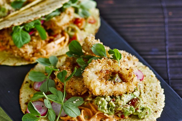 Taco Recipe with fried squid rings and kimchi on a black rectangular plate