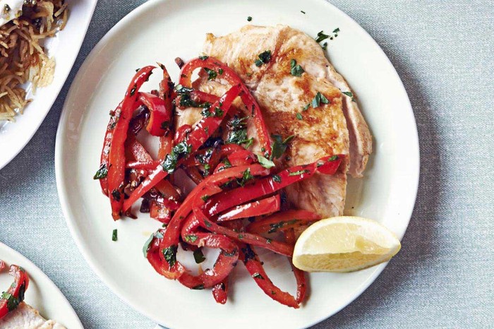 Chicken paillard escalope, topped with red peppers