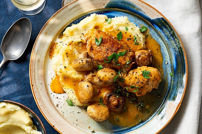A chicken chasseur with cheese and roasted garlic mash