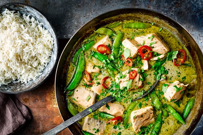 Green Thai Fish Curry in a Pan with Rice on the Side