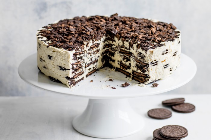 Oreo Baileys fridge cake, with a large chunk taken out to reveal the layered filling