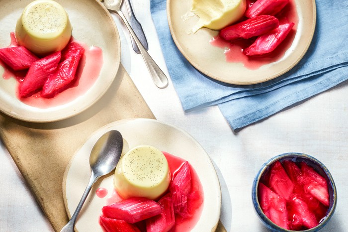 Plates of panna cotta with stewed rhubarb